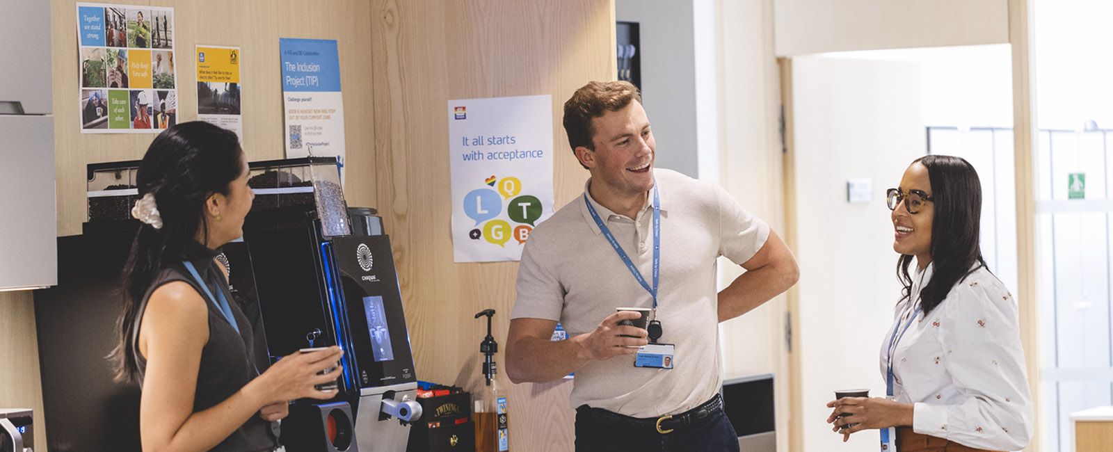 Three Yara colleagues chatting by coffee machine